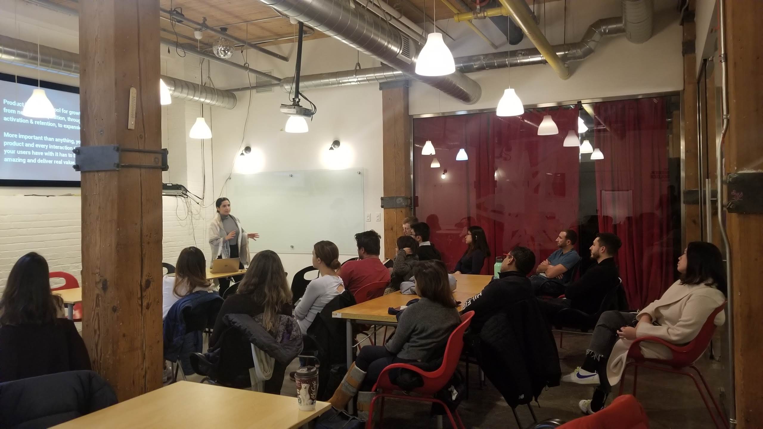 Mayank speaking at a Product School event